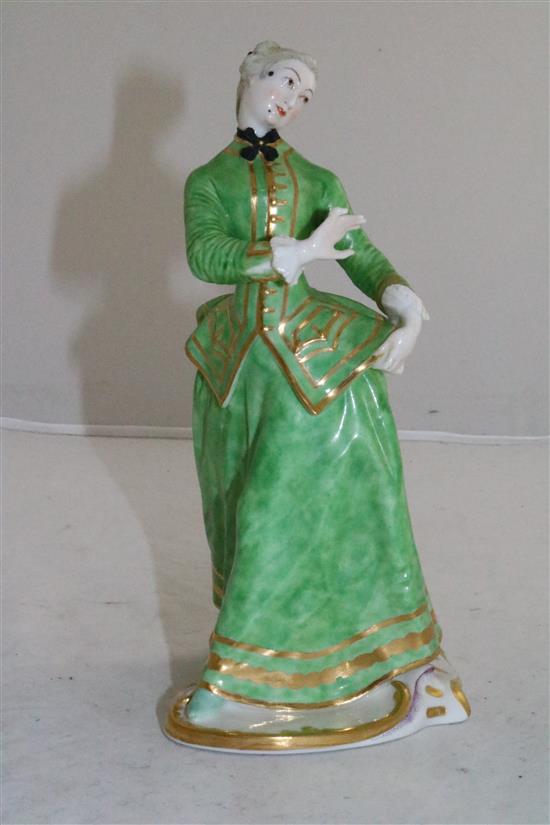 A Nymphenburg porcelain figure of Julia, after the Commedia Dellarte figure by Bustelli, 20th century, height 21.5cm (8.5in.)